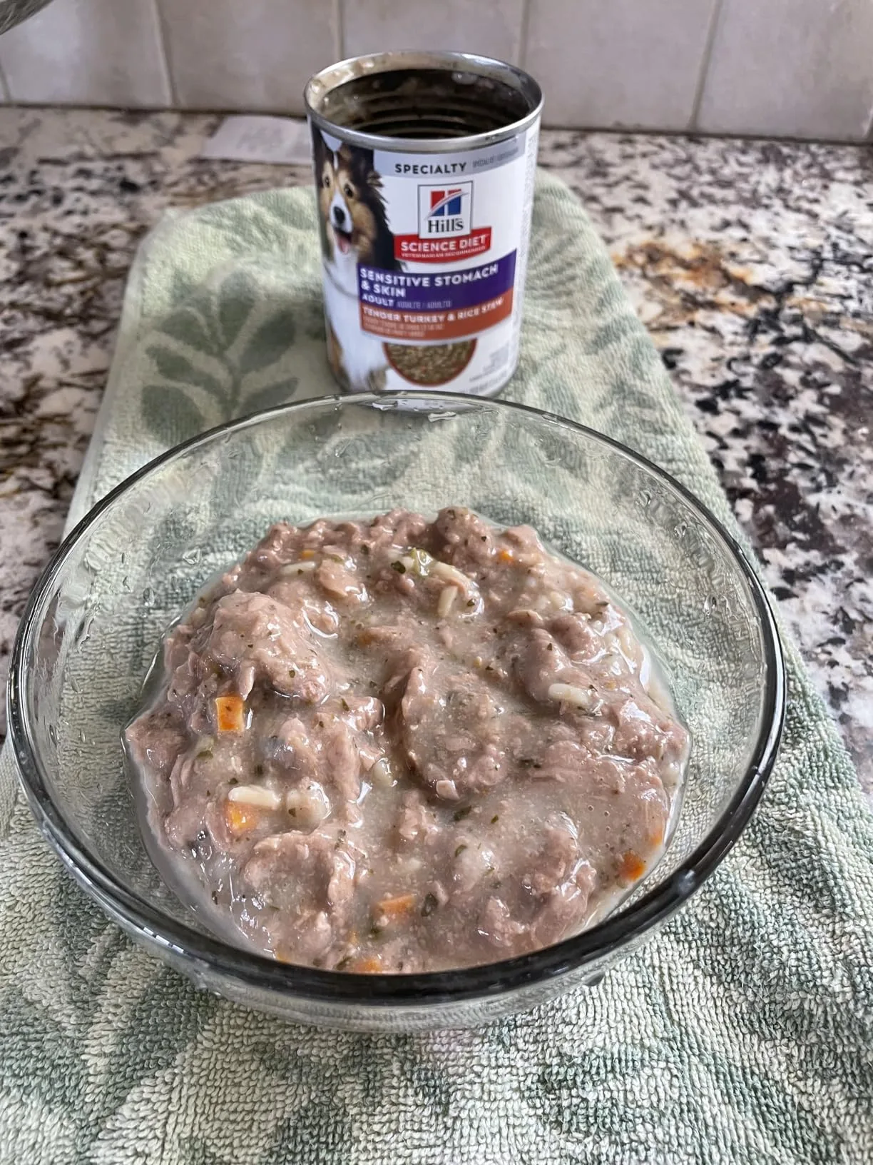 The case of Hill's Science Diet Sensitive Stomach & Skin cans sitting on my counter, one can opened